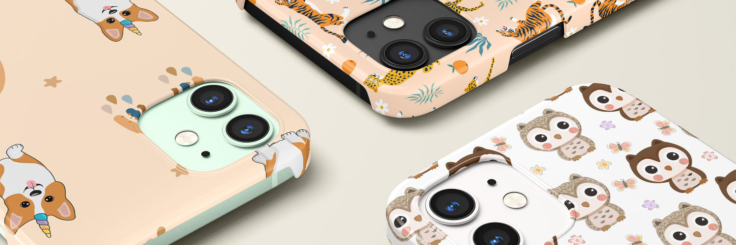 Three iPhones with animal cases. One with a unicorn corgi design, the next with a baby owl design, and the last with a wild cats design.