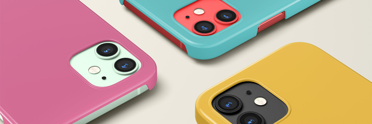 Three iPhones with solid color cases. One pink, one teal, and one yellow.