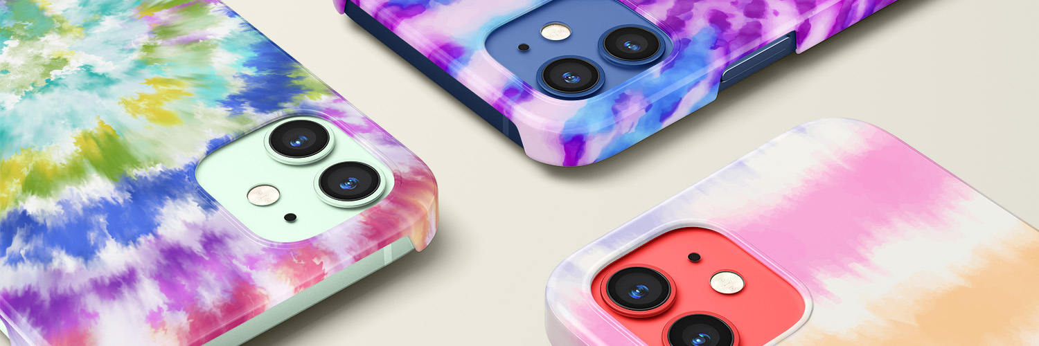 Three iPhones with tie-dye designs