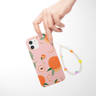 Juicy Pearls Pearls and Fruit Phone Charm on a Just Peachy Phone Case 